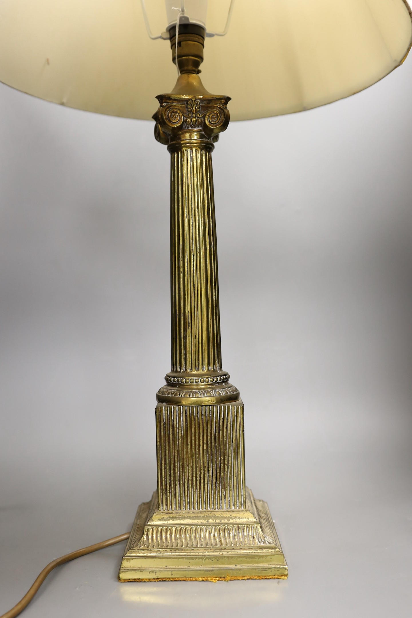 A brass Corinthian column table lamp